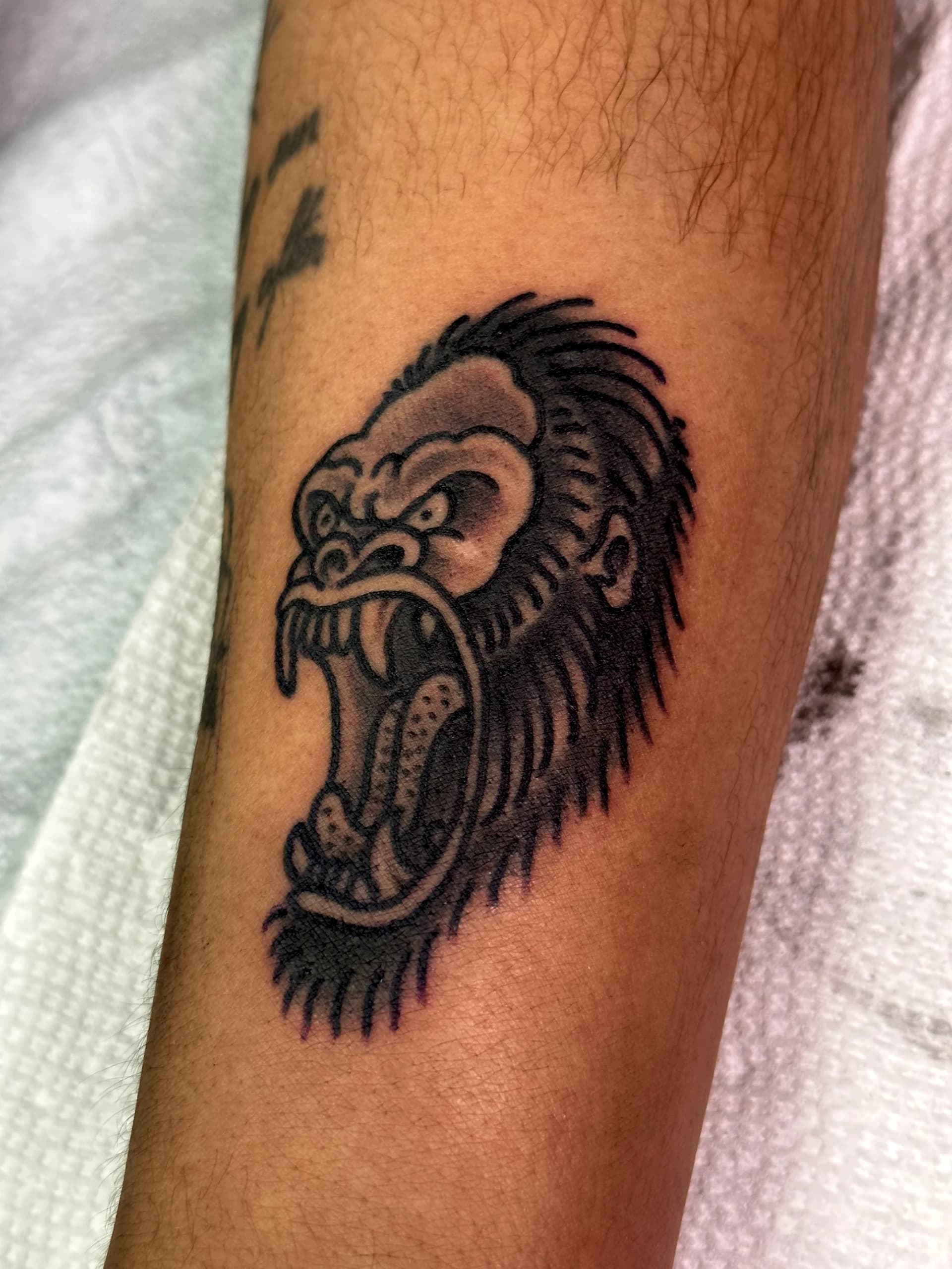Gorilla blackwork traditional chest tattoo by Nate at Village Tattoo Company London Ontario