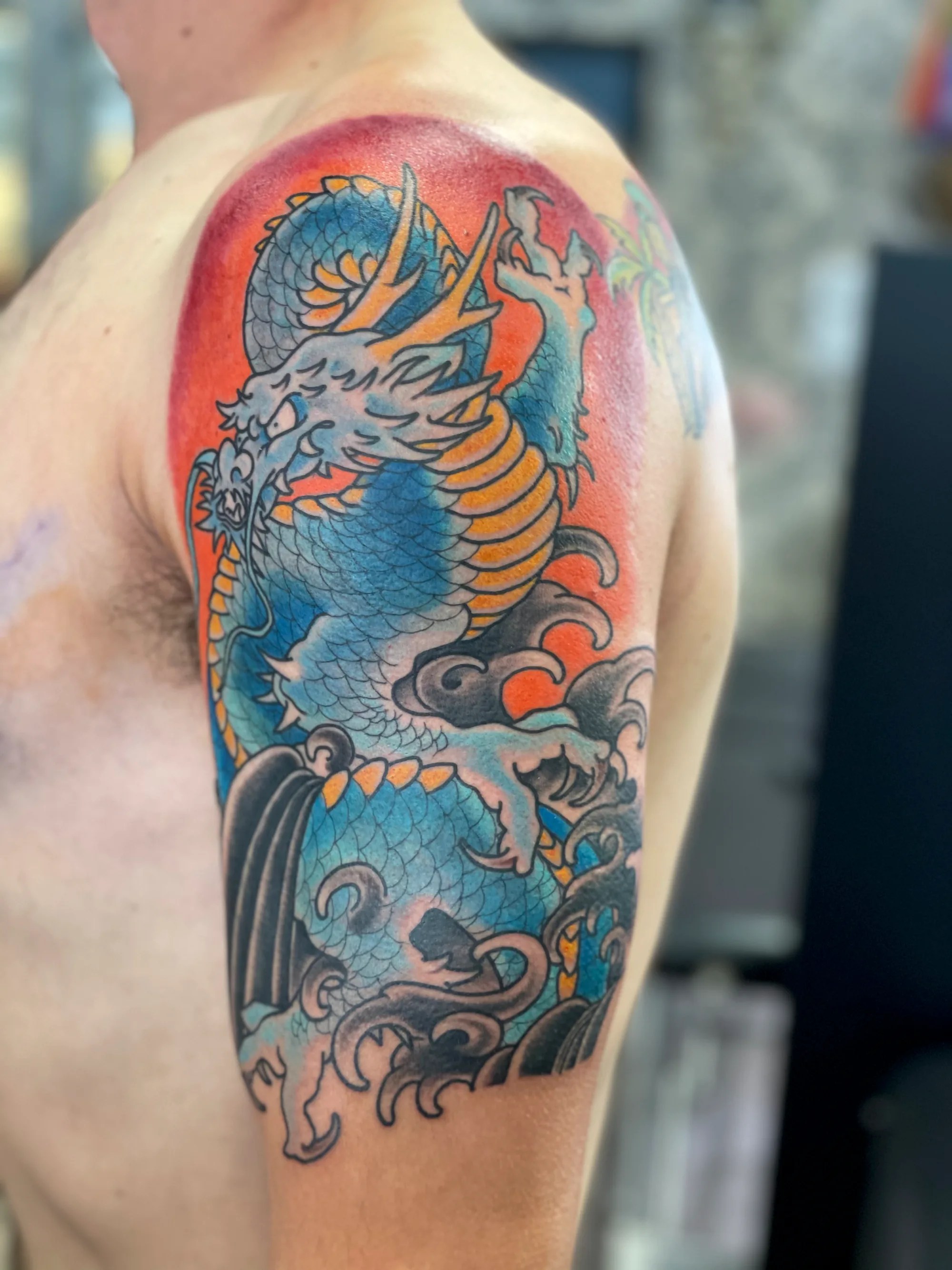 Blue dragon Japanese half sleeve tattoo by Nate at Village Tattoo Company London Ontario