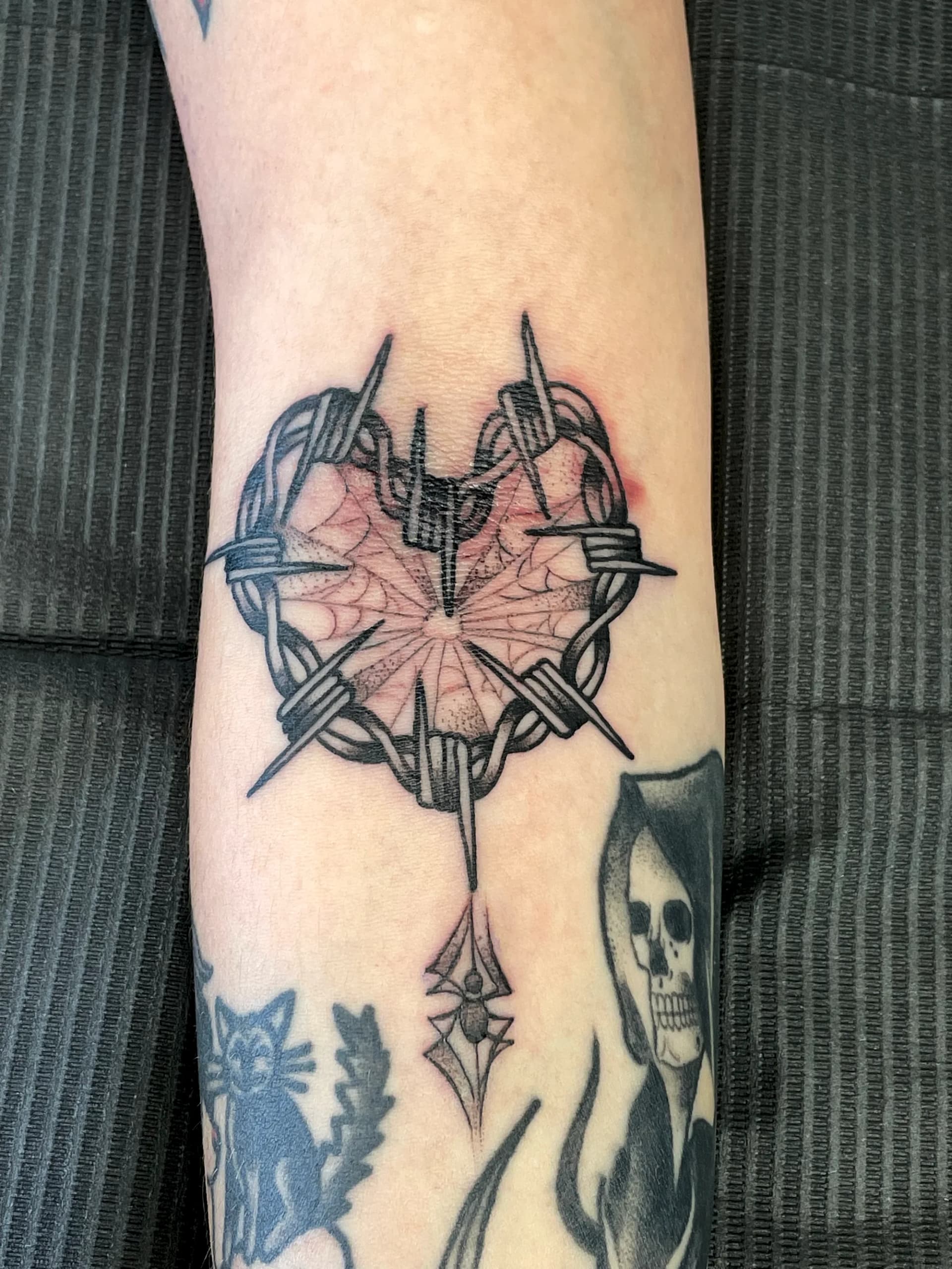 Barbed wire heart blackwork hand tattoo by Nate at Village Tattoo Company London Ontario
