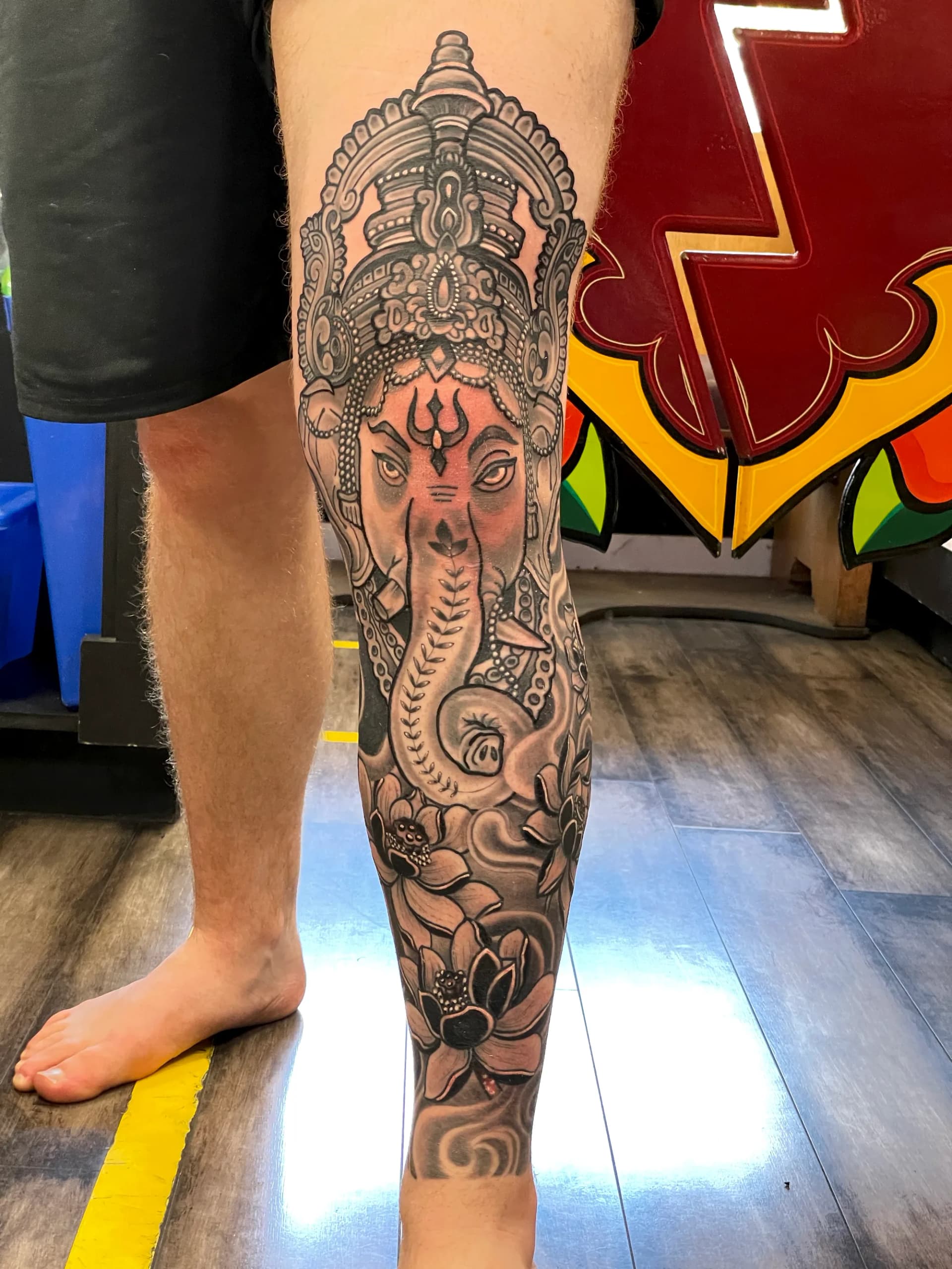 Ganesha black and grey leg tattoo by Nate at Village Tattoo Company London Ontario