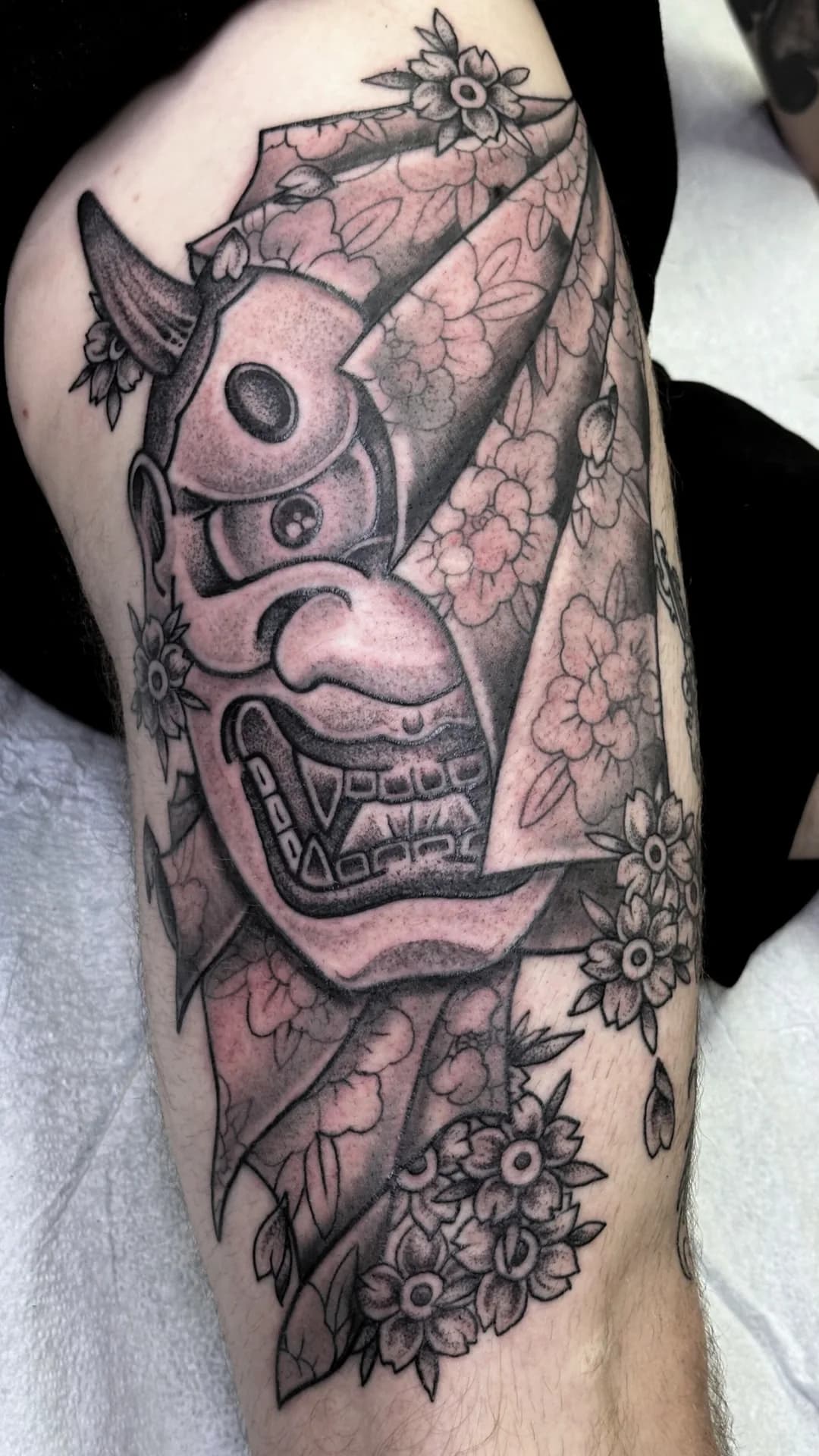 Hannya mask with veil black and grey tattoo by Nate at Village Tattoo Company London Ontario