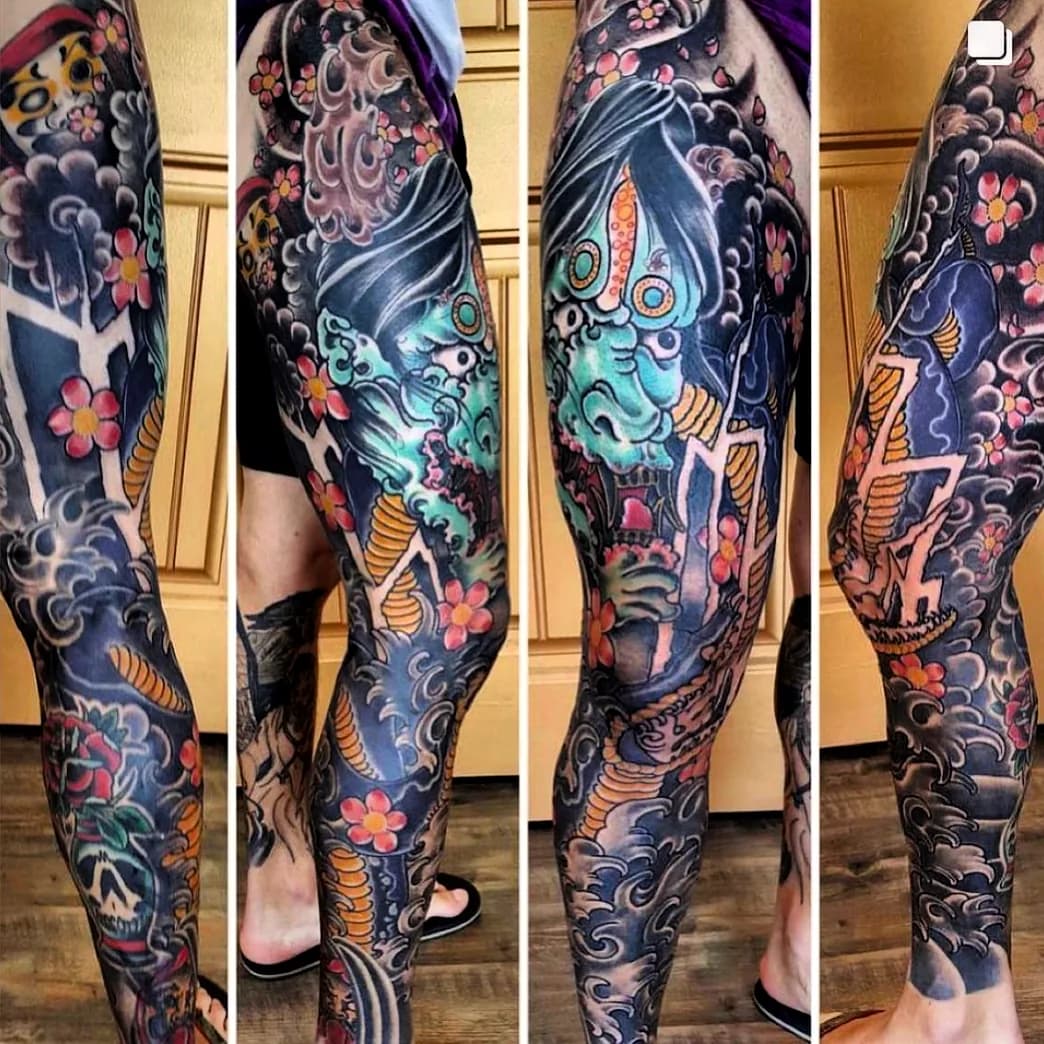 Japanese hannya mask with lightning bolts leg sleeve tattoo by Nate at Village Tattoo Company London Ontario