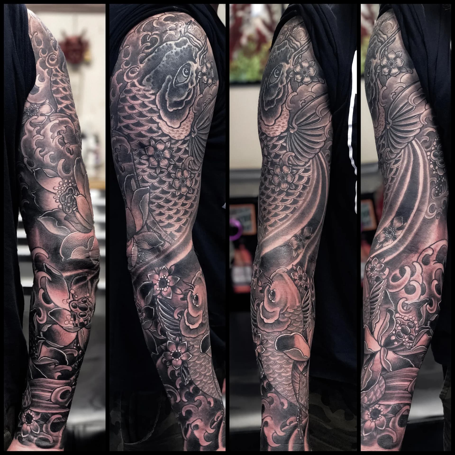 Black and grey Japanese koi fish full sleeve tattoo with cherry blossoms and waves by Nate at Village Tattoo Company London Ontario