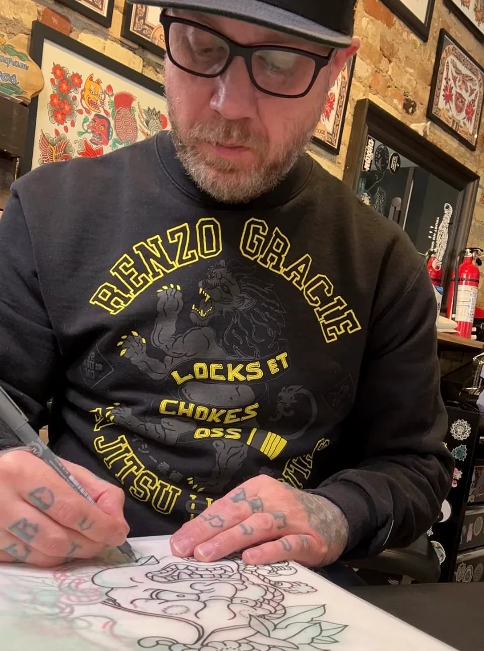 Nate tattooing a client at Village Tattoo Company in London Ontario