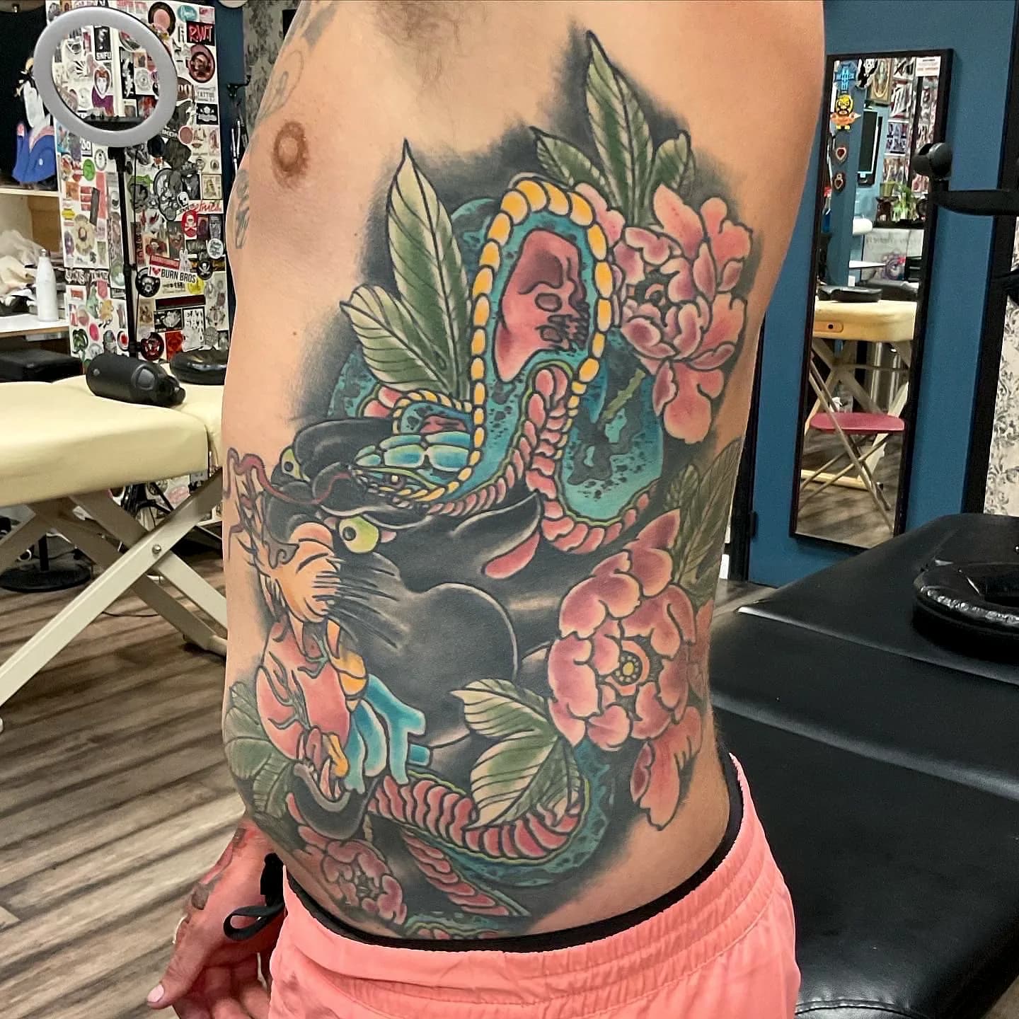 Panther and snake ribs traditional tattoo by Nate at Village Tattoo Company London Ontario