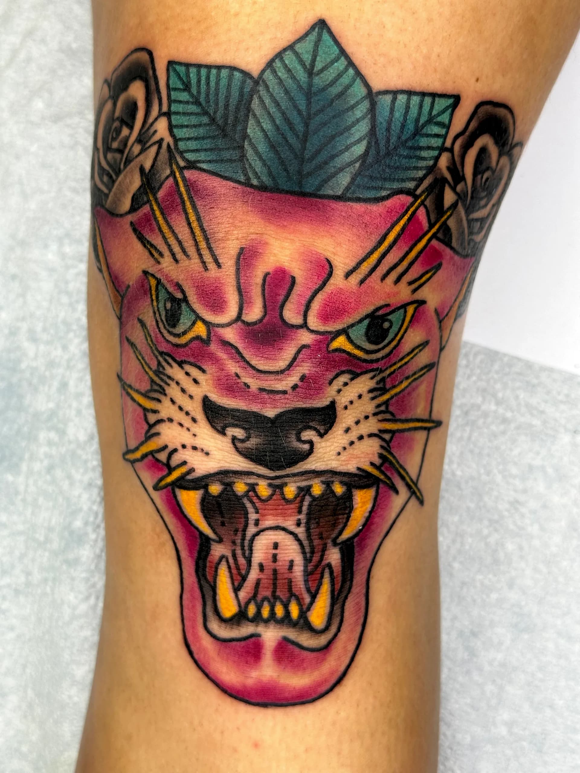 Pink panther knee traditional tattoo by Nate at Village Tattoo Company London Ontario