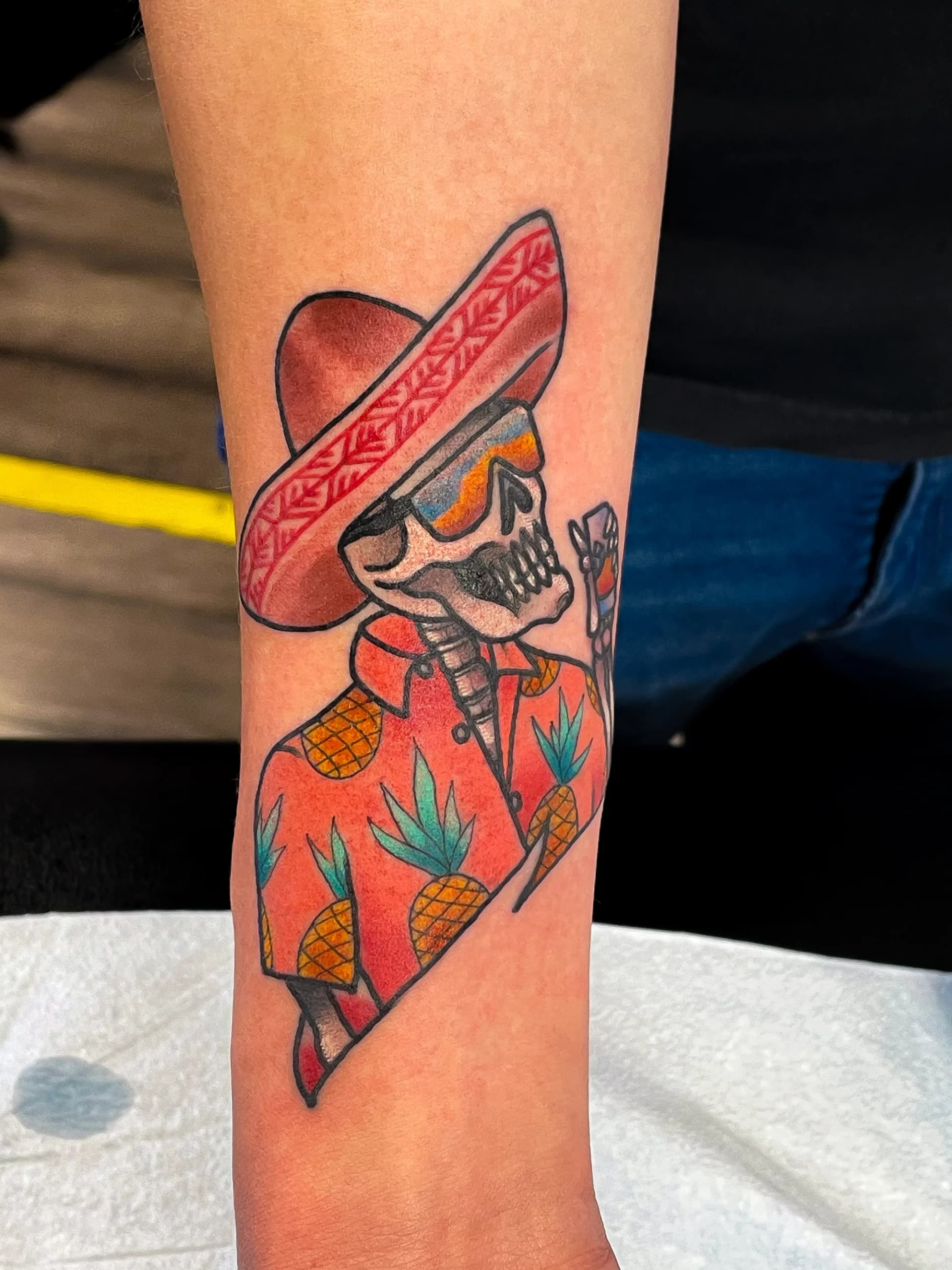 Skeleton wearing sombrero and Hawaiian shirt traditional colour tattoo by Nate at Village Tattoo Company London Ontario