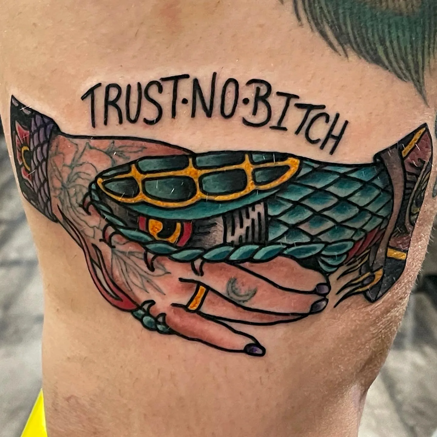 Trust No Bitch snake handshake traditional tattoo by Nate at Village Tattoo Company London Ontario
