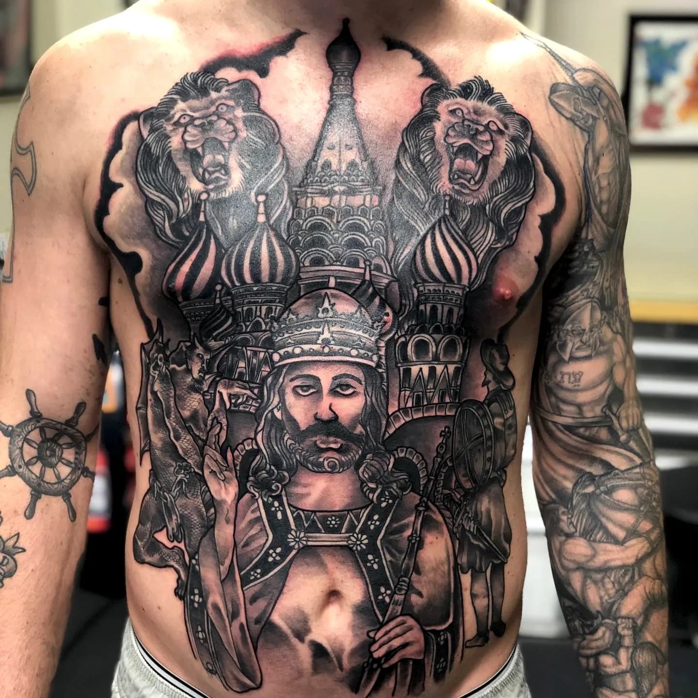 Warrior king black and grey realism chest piece tattoo by Nate at Village Tattoo Company London Ontario